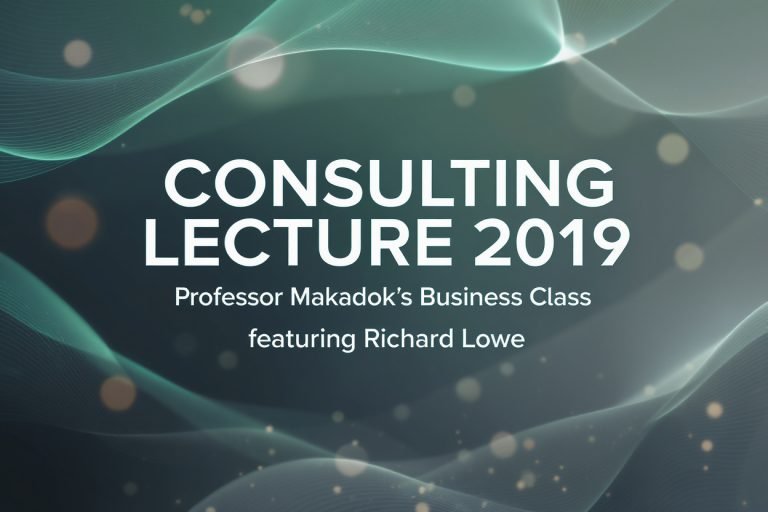 Richard Lowe speaking during a university consulting lecture, with students visible in a classroom setting.