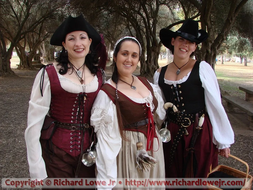 Three women in pirate costumes at the Kearney Park Renaissance Faire in Fresno, California